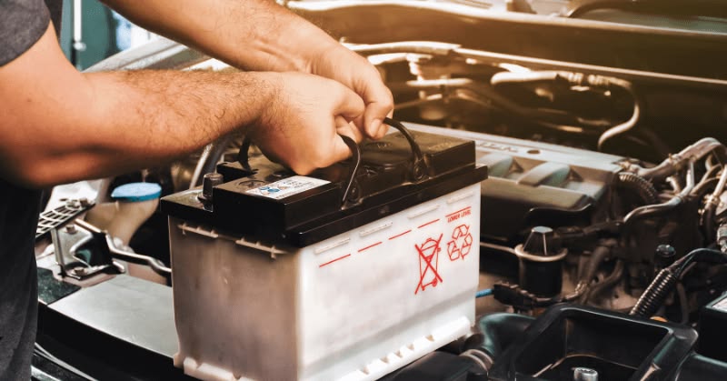 Car battery and charging system inspection at a workshop